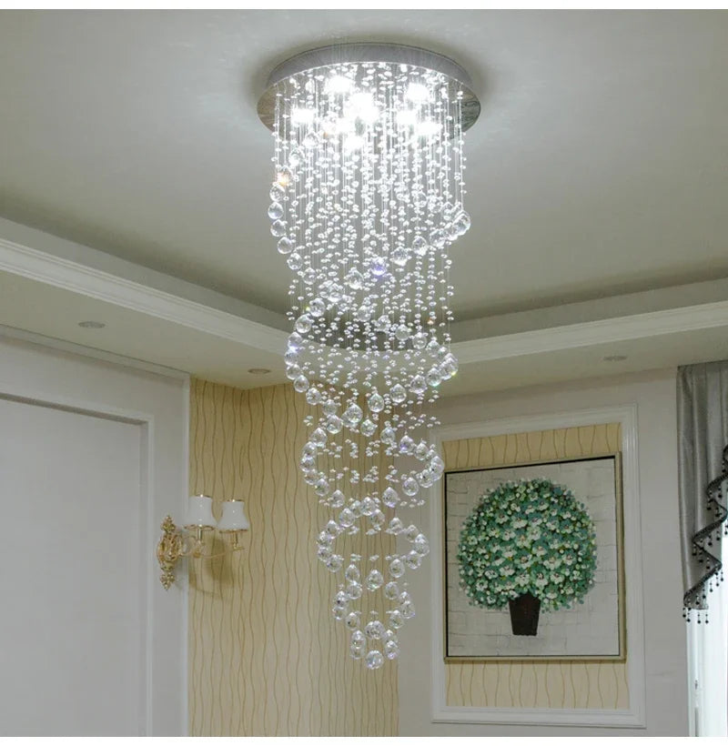 A spiral crystal LED ceiling chandelier with a silver base and cascading clear faceted beads in tiered rows
