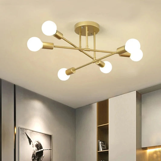 Gold-toned modern nordic sputnik led chandelier ceiling light with six spherical bulbs in a symmetrical branching design