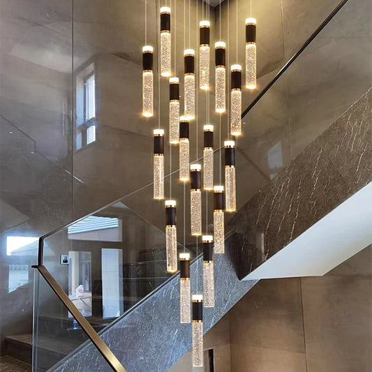 Modern crystal chandelier with cascading cylindrical glass tubes featuring black metallic caps and glowing led lights