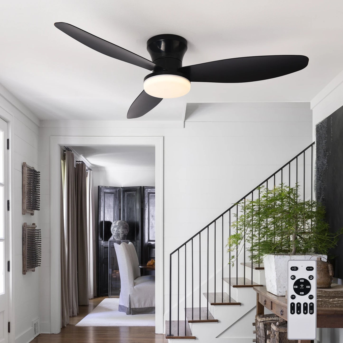 Black ceiling fan with three blades and frosted glass light fixture with remote control for 3-color 6-speed settings
